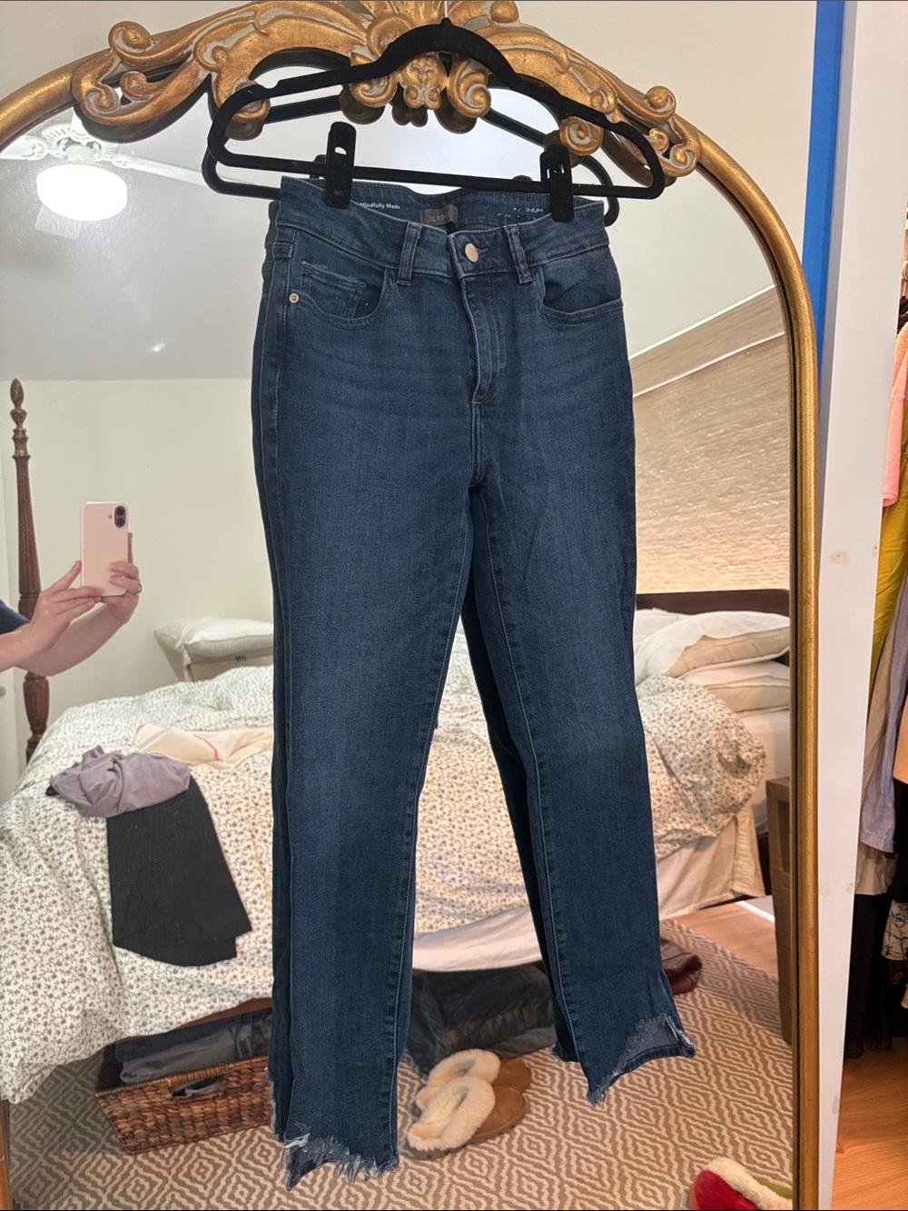DL 1961 skinny jeans with frayed hem.